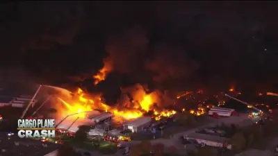 Officials scour charred site of Kentucky UPS plane crash for victims and answers