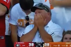 Fan playing hooky goes viral for animated reactions caught by jumbotron during Tennessee-Georgia football game: ‘I got Coldplayed’