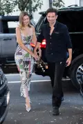 Gigi Hadid holds hands with Bradley Cooper as they celebrate her Vogue cover in NYC
